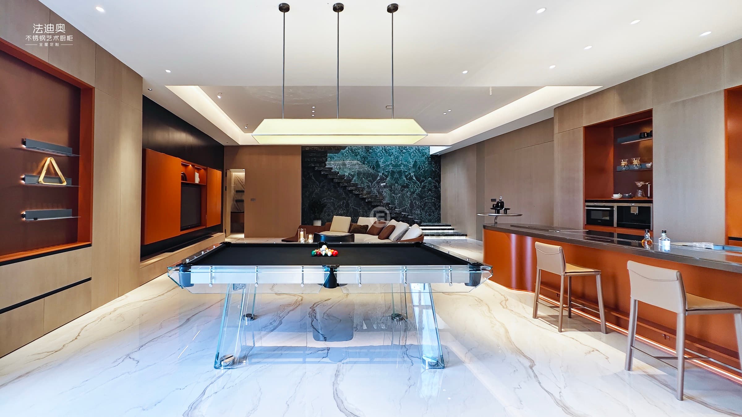 Showroom hero view with stainless steel cabinetry and warm lighting.