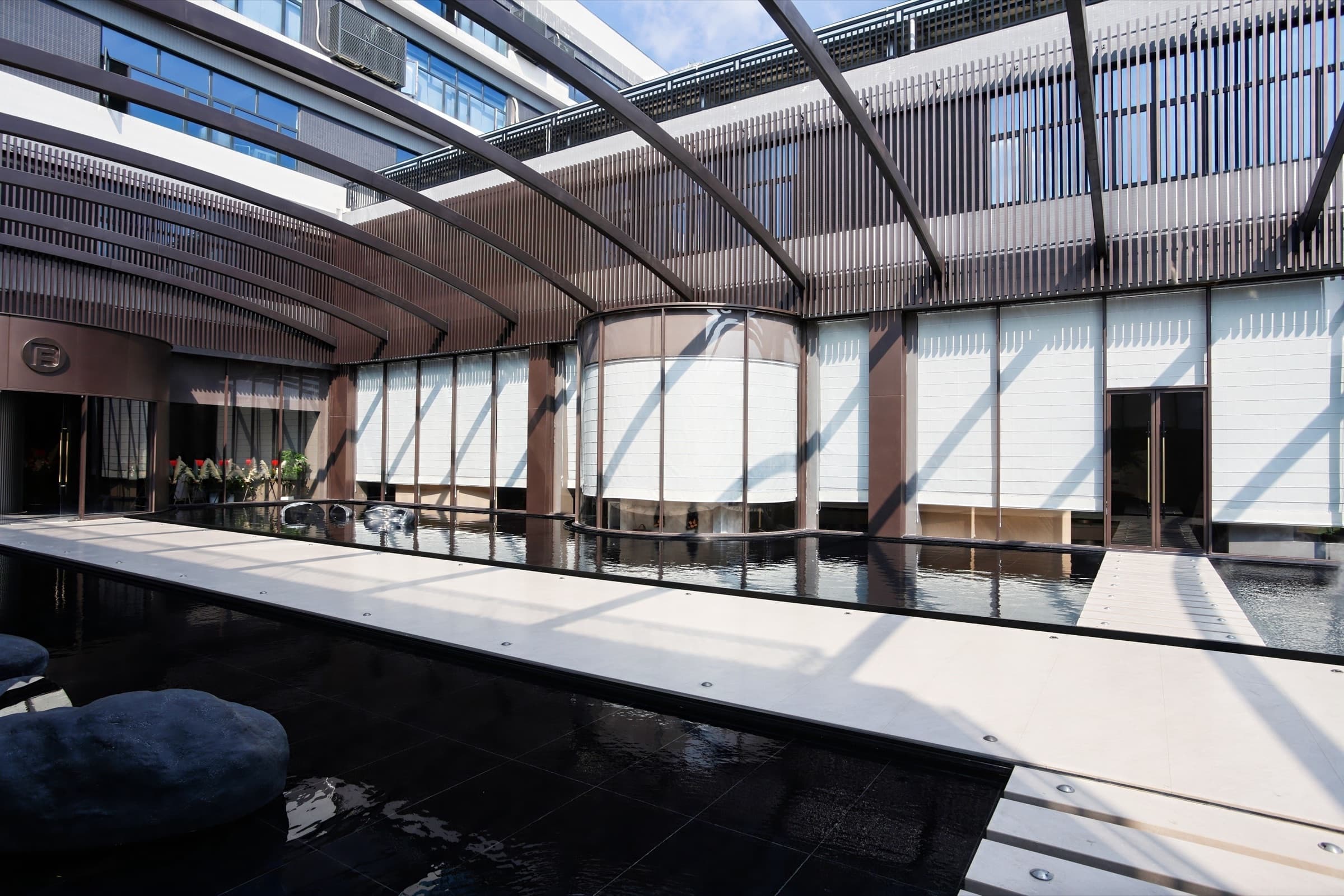 Open showroom room with layered cabinetry and hospitality setting.