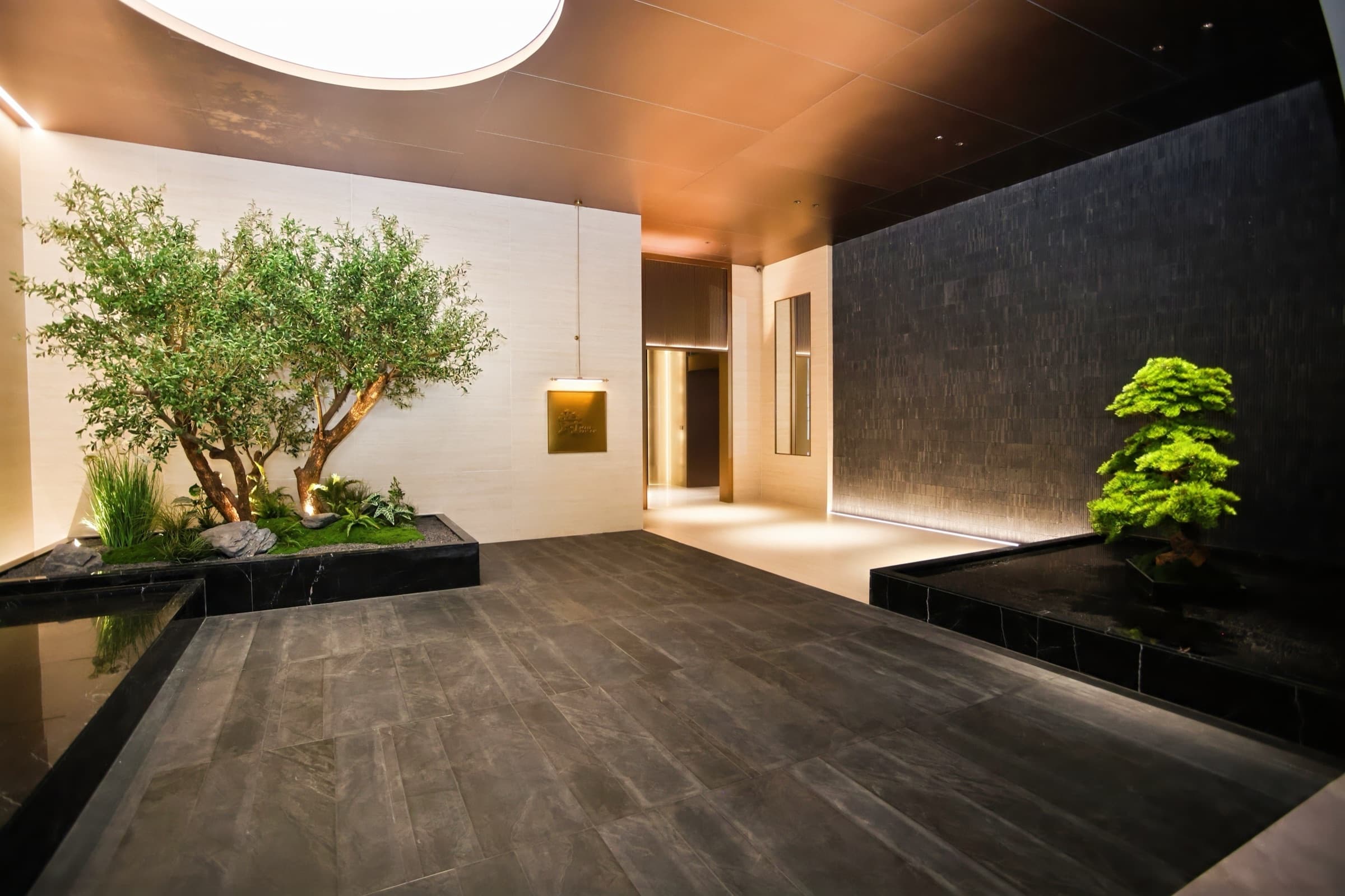 Lighting detail across cabinet planes and reflective finishes.