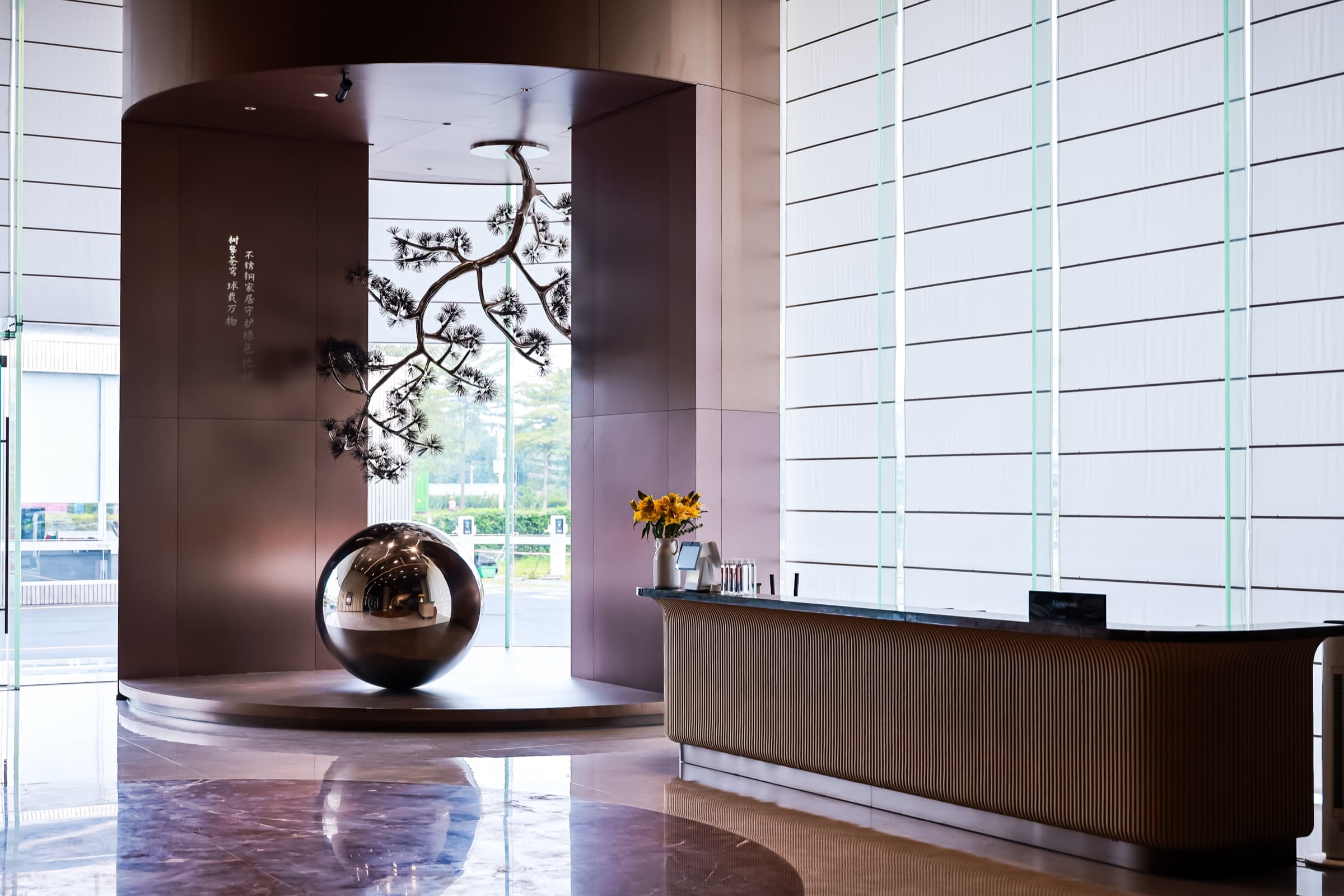 Closing gallery image with sculptural cabinetry and soft light.