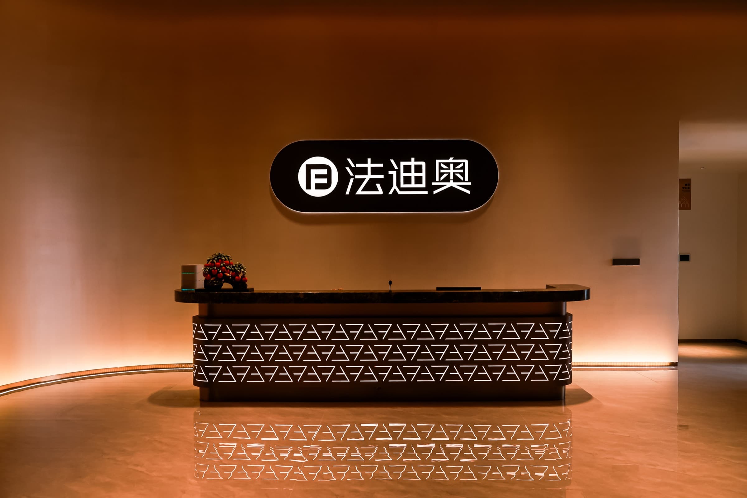 Interior still life of cabinetry, surfaces, and reflective accents.