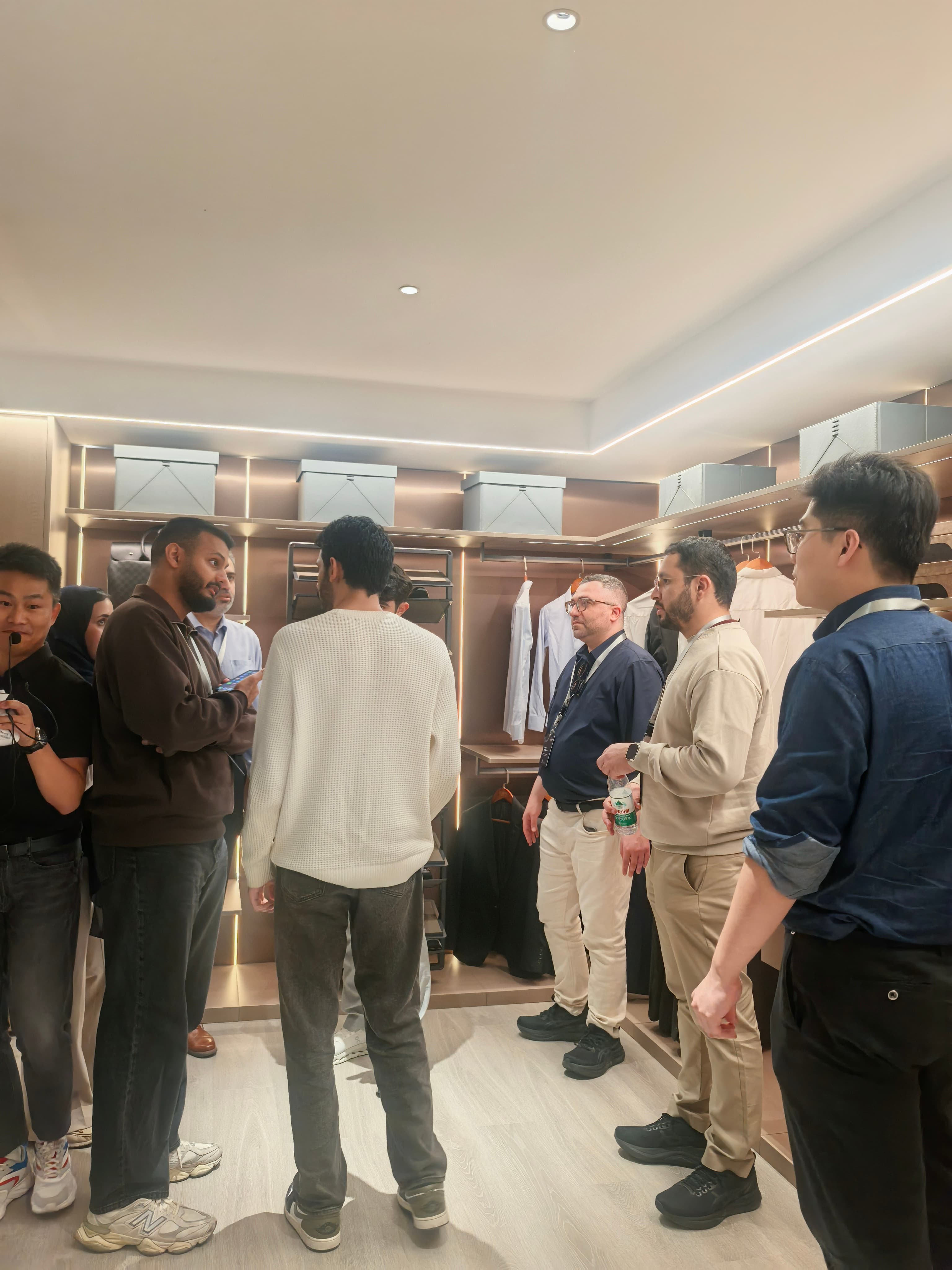 Visiting group reviewing showroom details and circulation