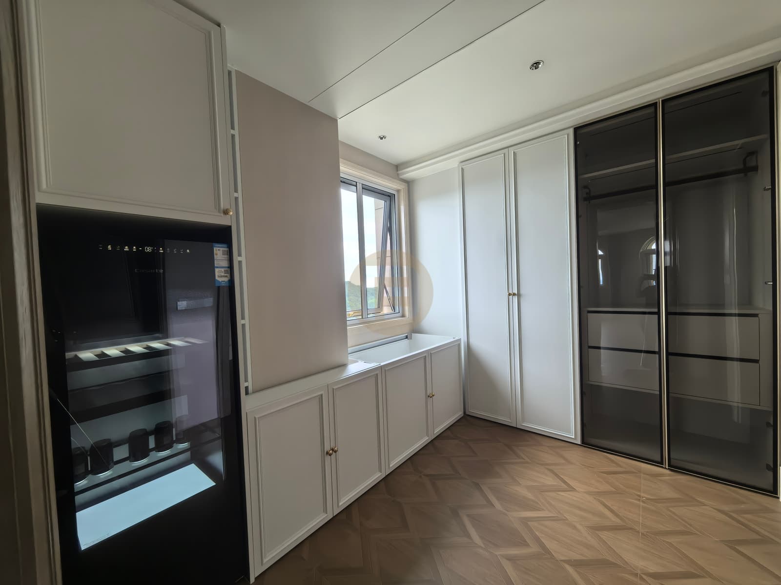 Window-side low cabinet with top or cover not visible at capture