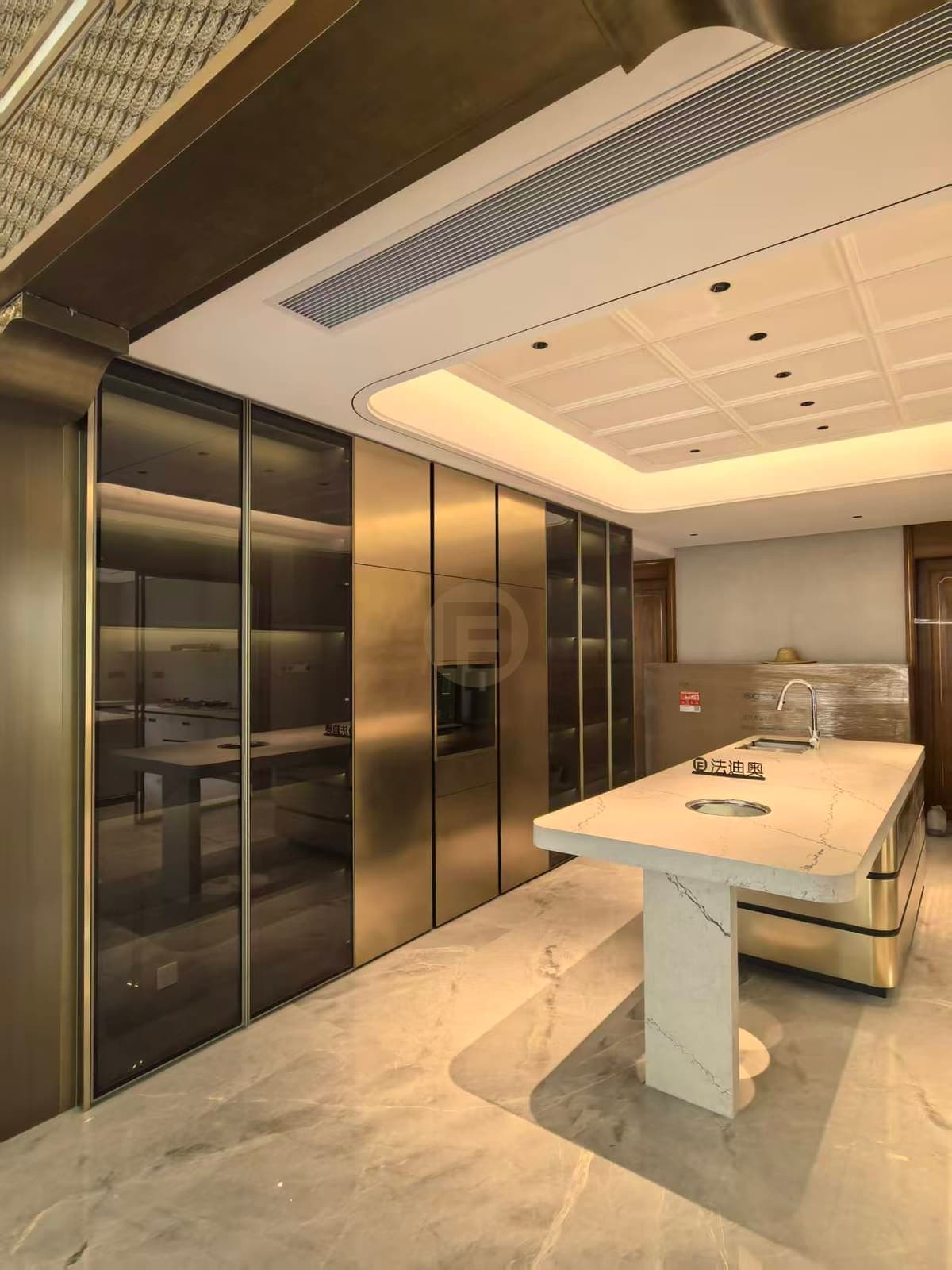 Metallic-tone kitchen wall and island beside protective wrapping