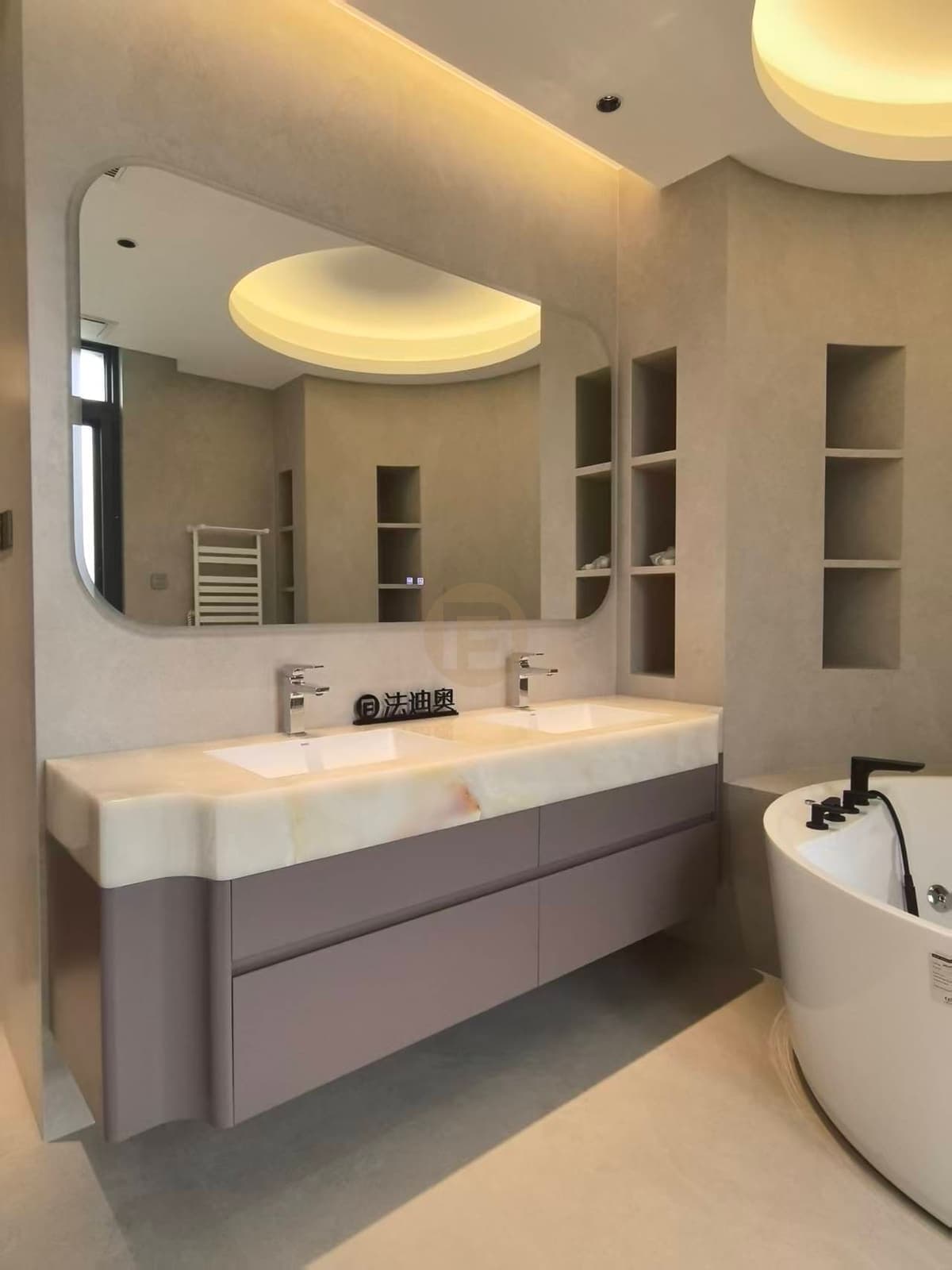 Double bathroom vanity and bathtub with cabinetry
