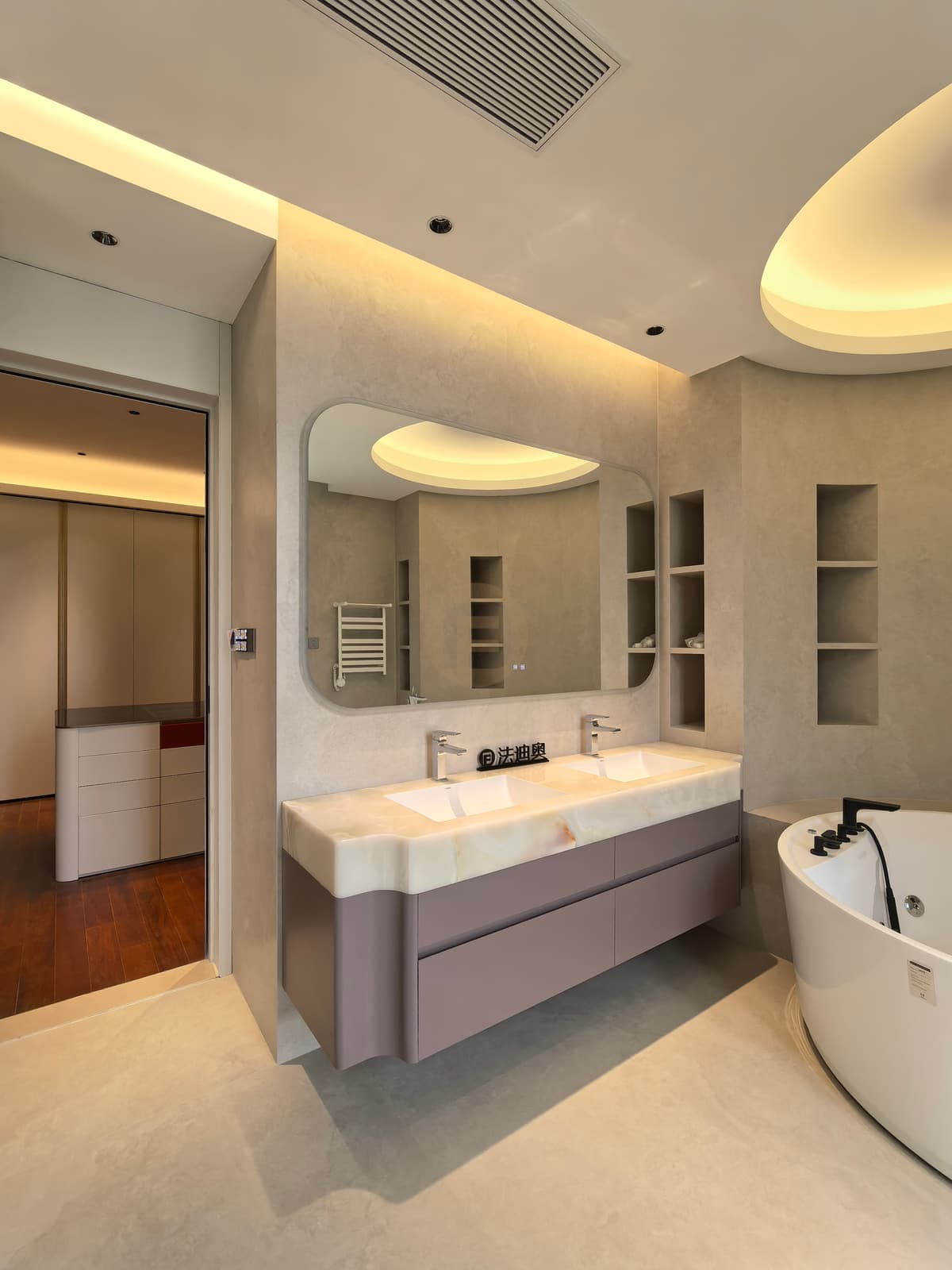 Bathroom vanity and fitted storage from a wider angle
