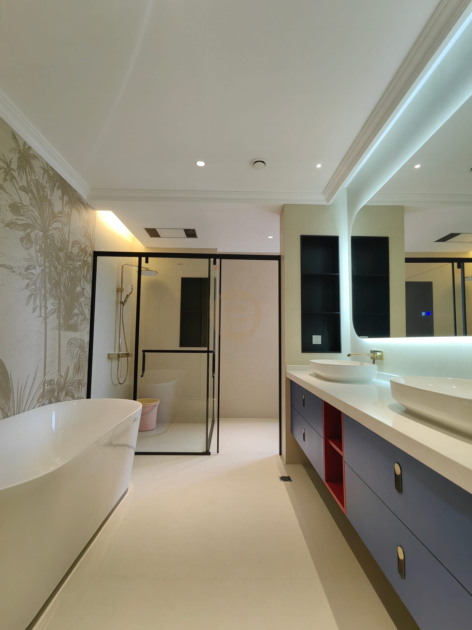 Completed bathroom with bathtub, shower screen and fitted vanity