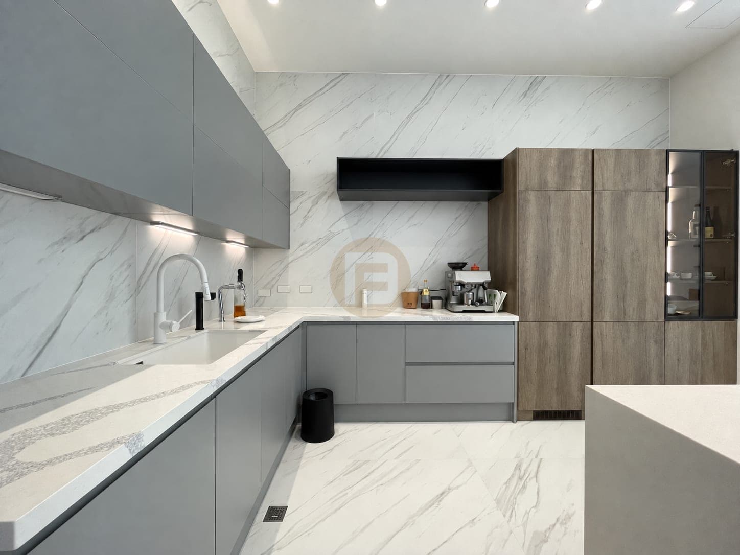 Grey and oak open kitchen with an island and coffee station