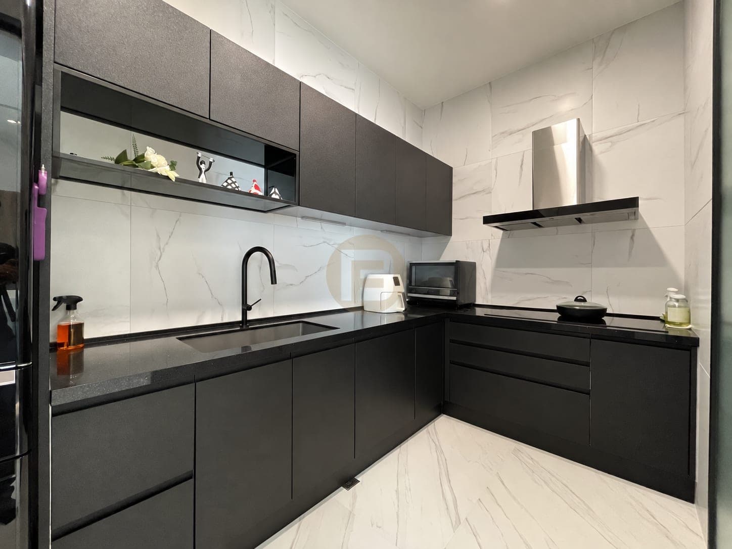 Reverse view of the enclosed kitchen with sink, hob and tall appliances