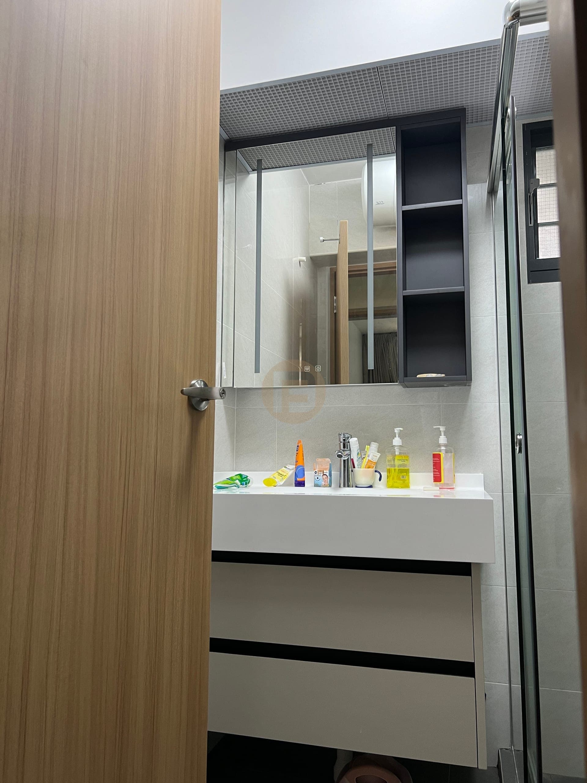 Compact bathroom vanity with mirror cabinet and open shelf