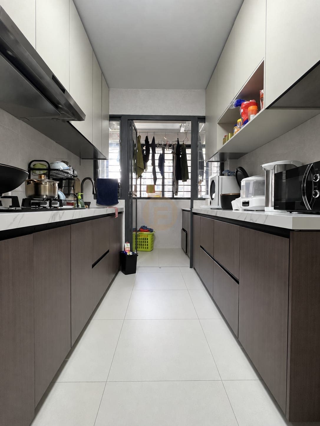 Narrow lived-in galley kitchen leading to the service yard
